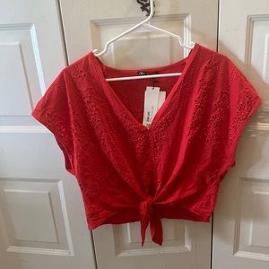 Reddish orange crop top knot